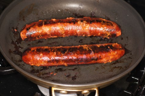 Cook linguica over medium low heat