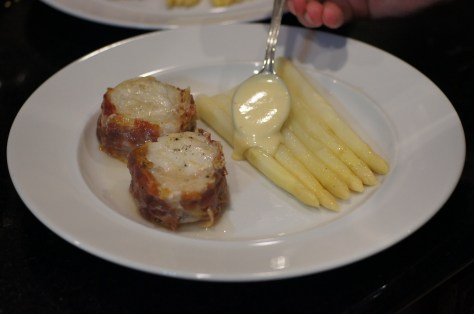 Spoon sauce on asparagus