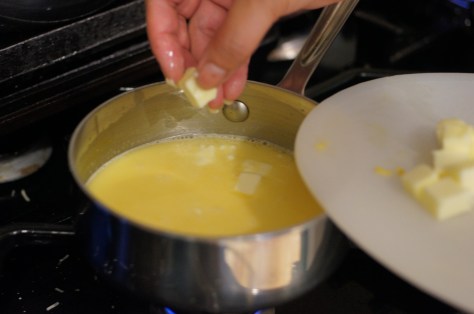 Add butter a little at a time, stirring to incorporate