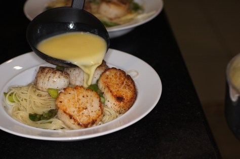 Pour sauce over top of scallops